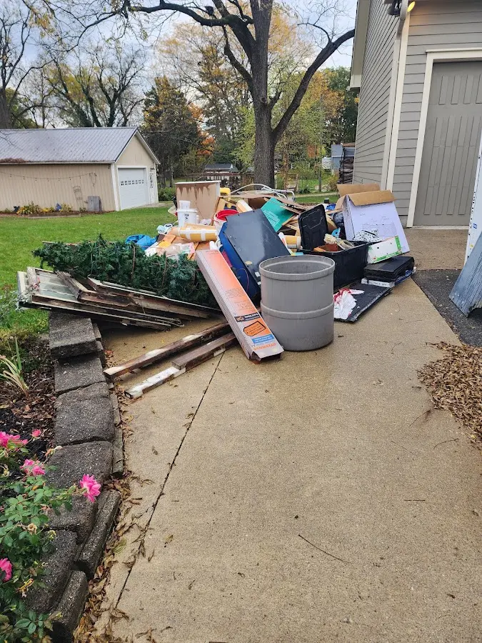 Dumpster being loaded with debris for Residential Dumpster Rental in Tiffin